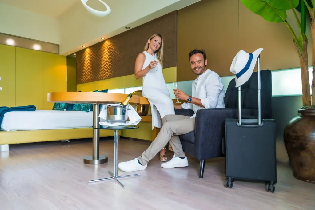 couple arriving at a luxury hotel and drinking cha 2024 12 10 02 12 35 utc